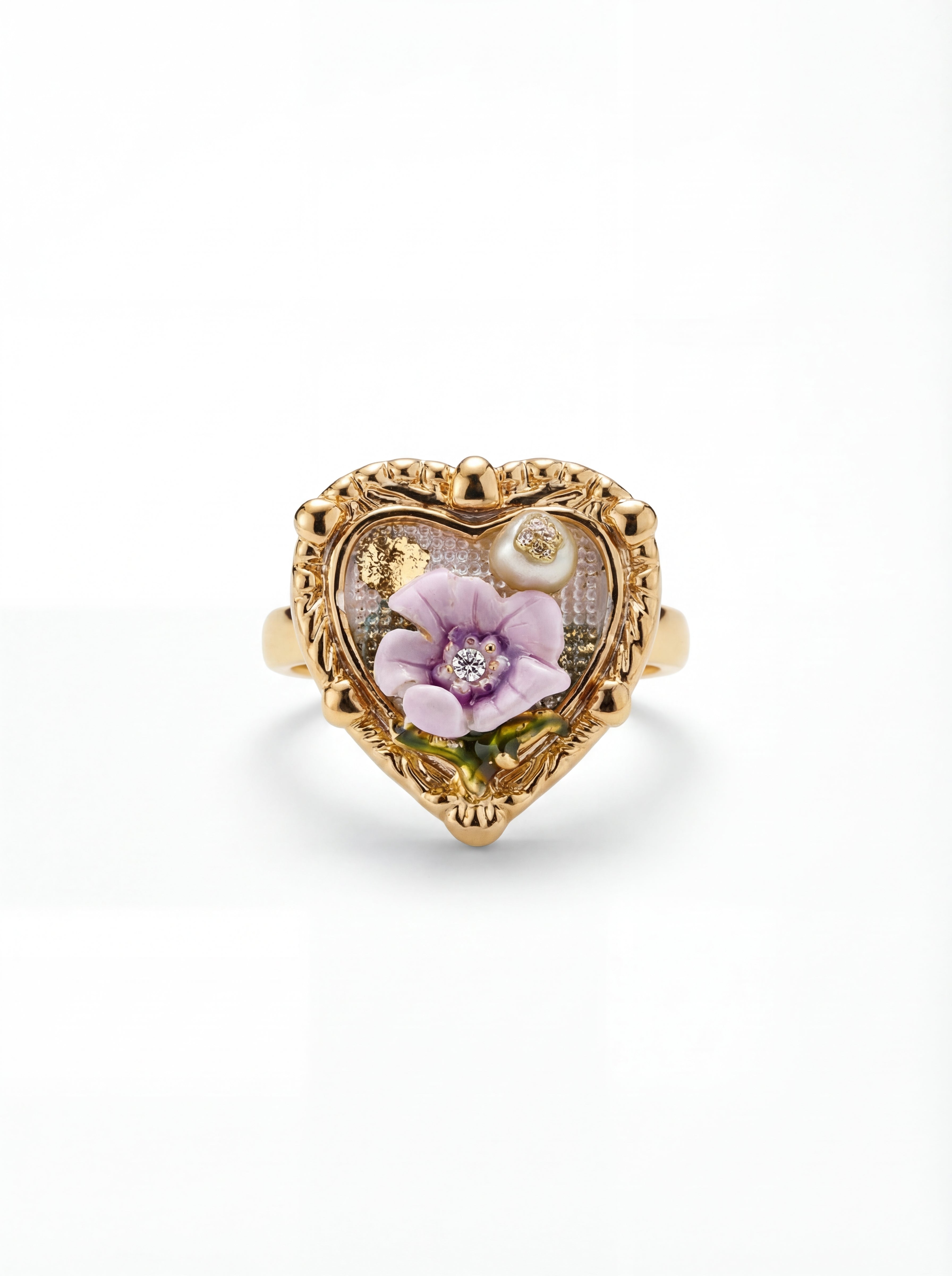 Heart-shaped gold ring with floral design on a white background