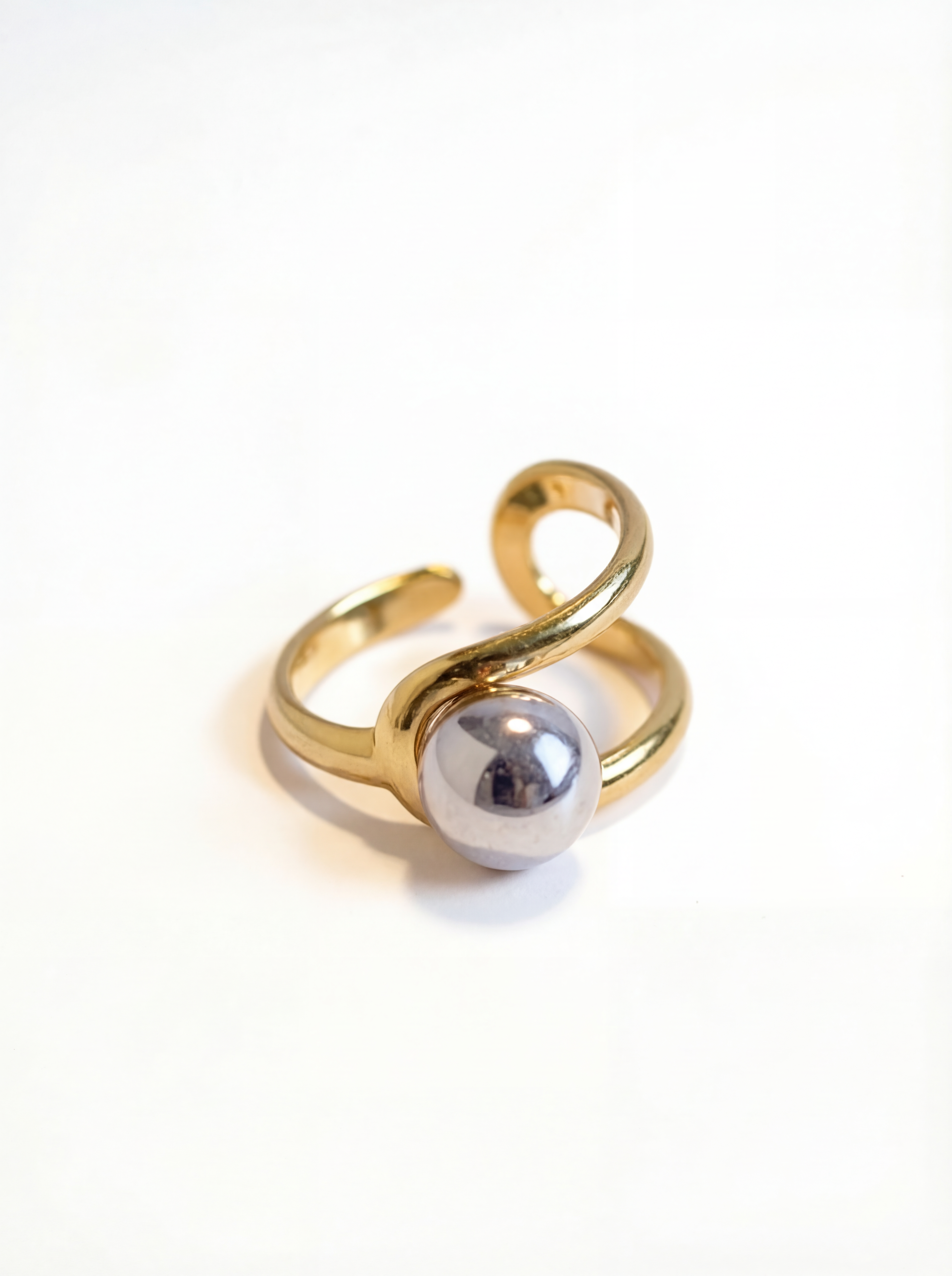 Gold and silver ring on a white background