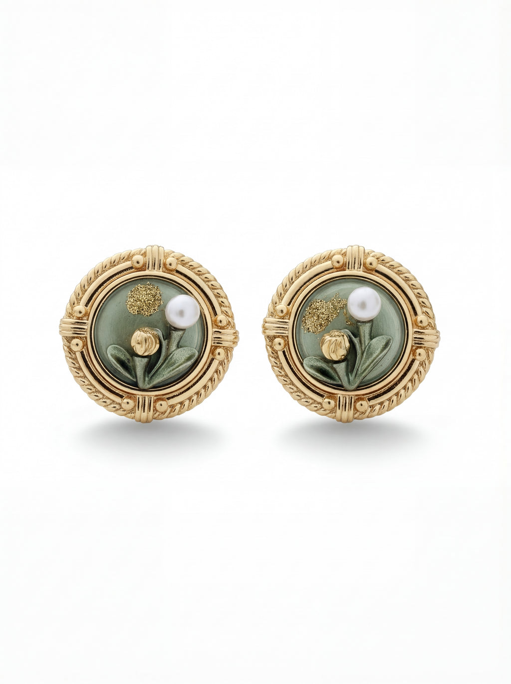 Pair of gold earrings with green stones and pearls on a white background