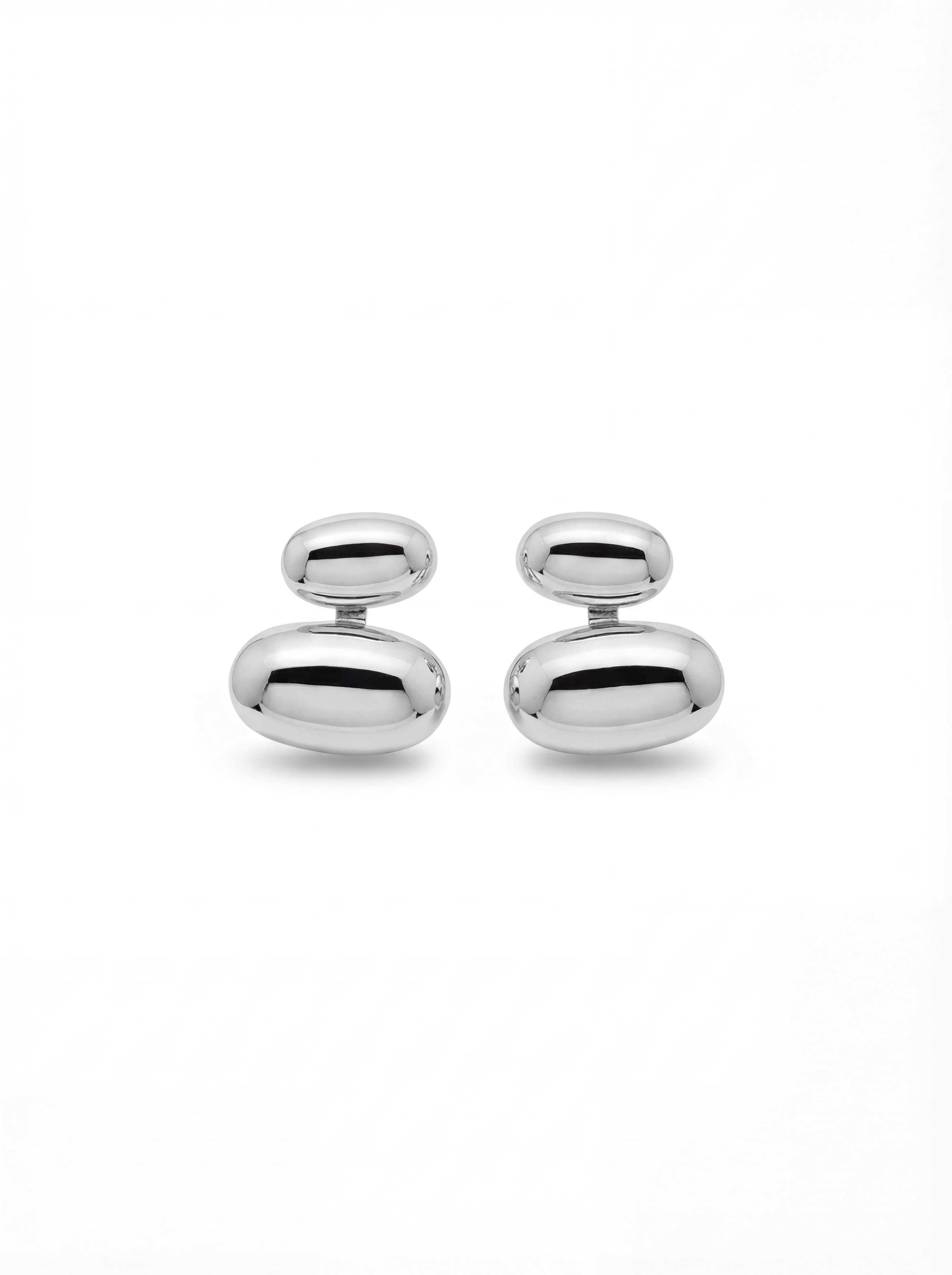Pair of silver oval-shaped cufflinks on a white background