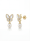 Butterfly-shaped earrings with pearl drops on a white background