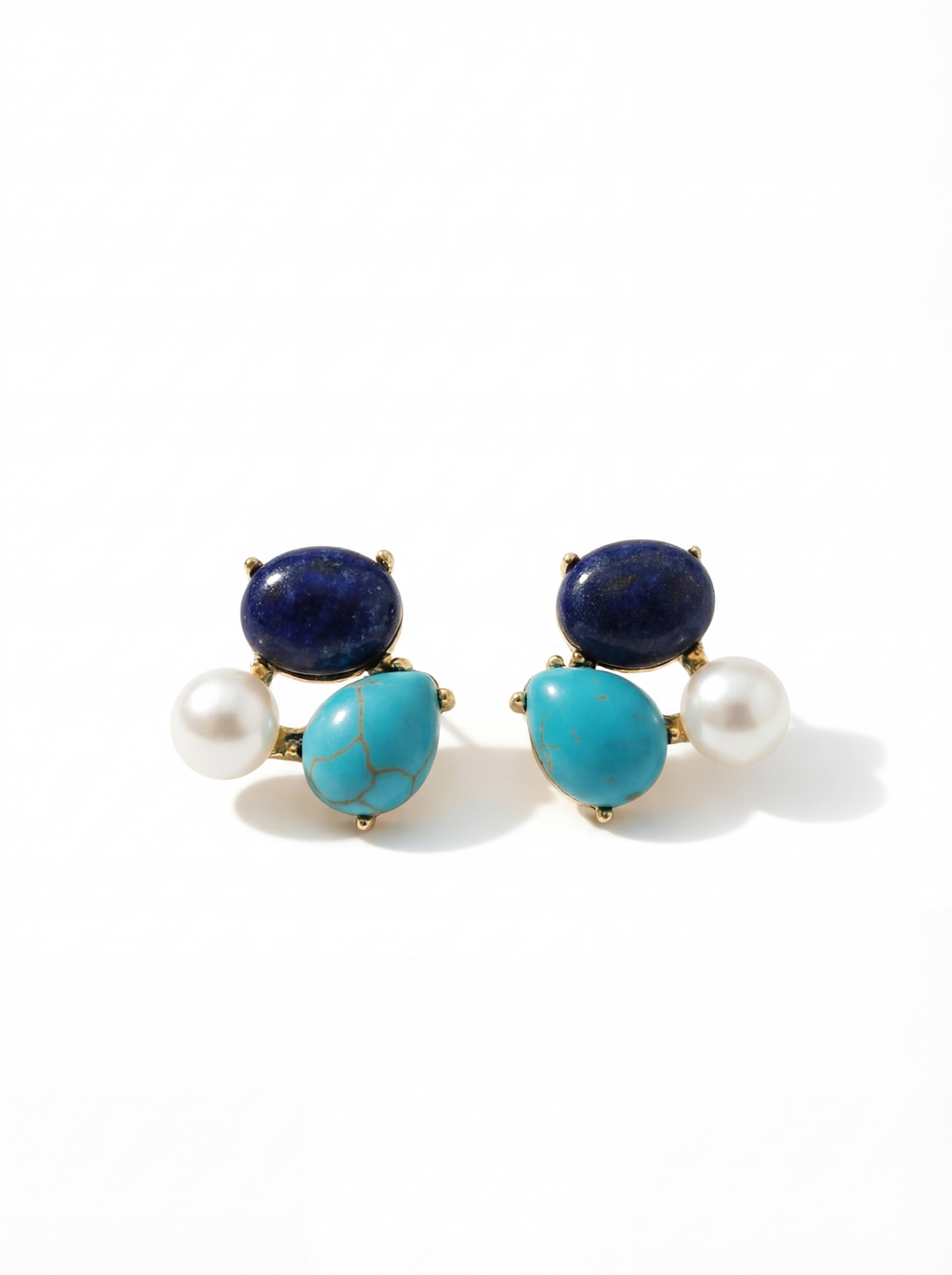 Pair of earrings with blue, turquoise, and pearl stones on a white background
