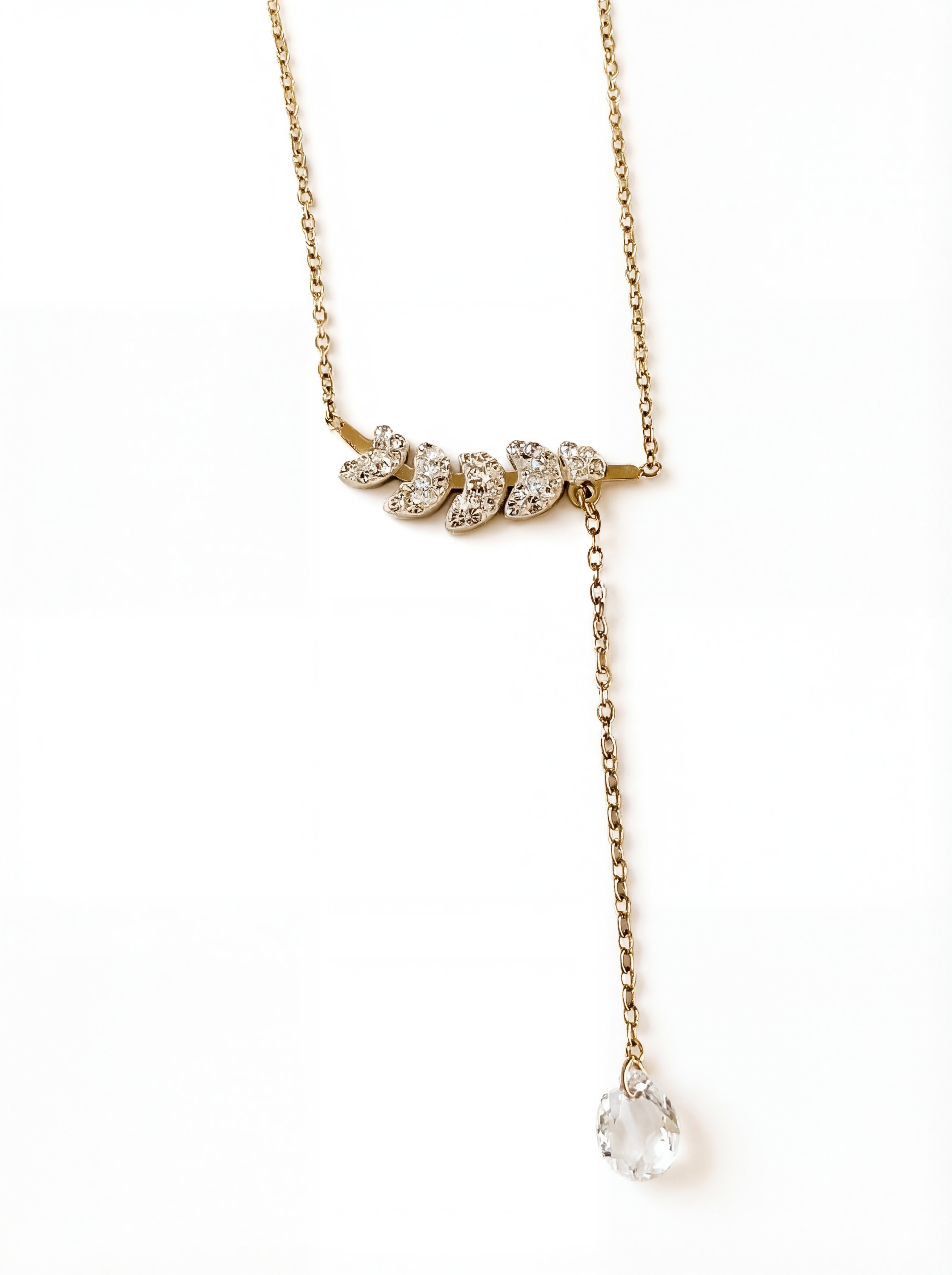 Gold necklace with diamond pendants on a white background