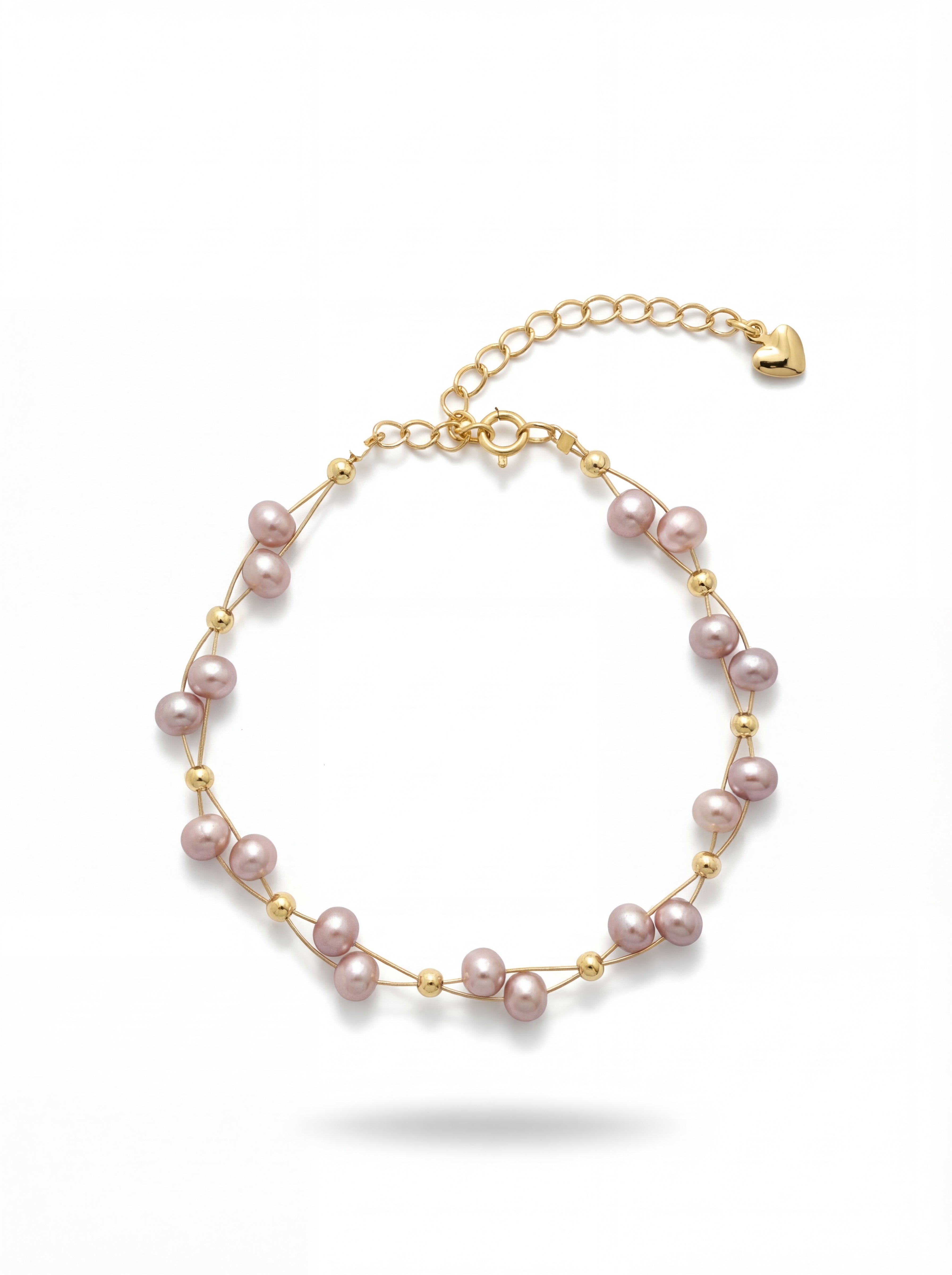 Pearl bracelet with gold accents on a white background