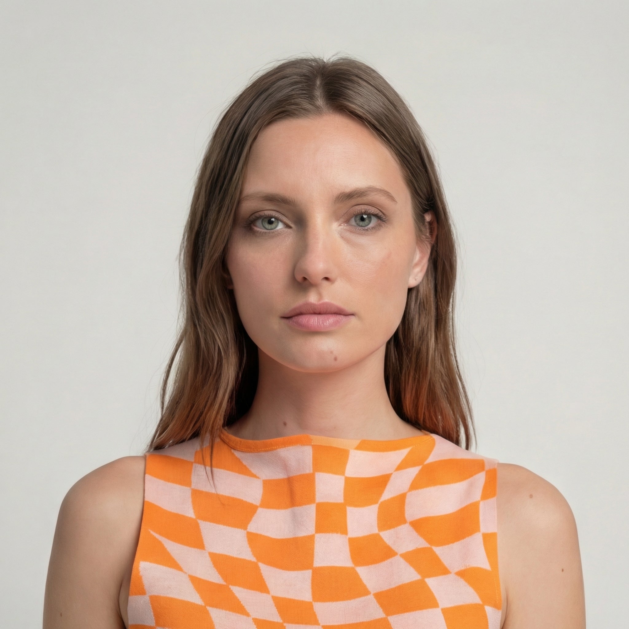 Ärmelloses Stricktop mit orangefarbenem Illusion-Schachbrettmuster